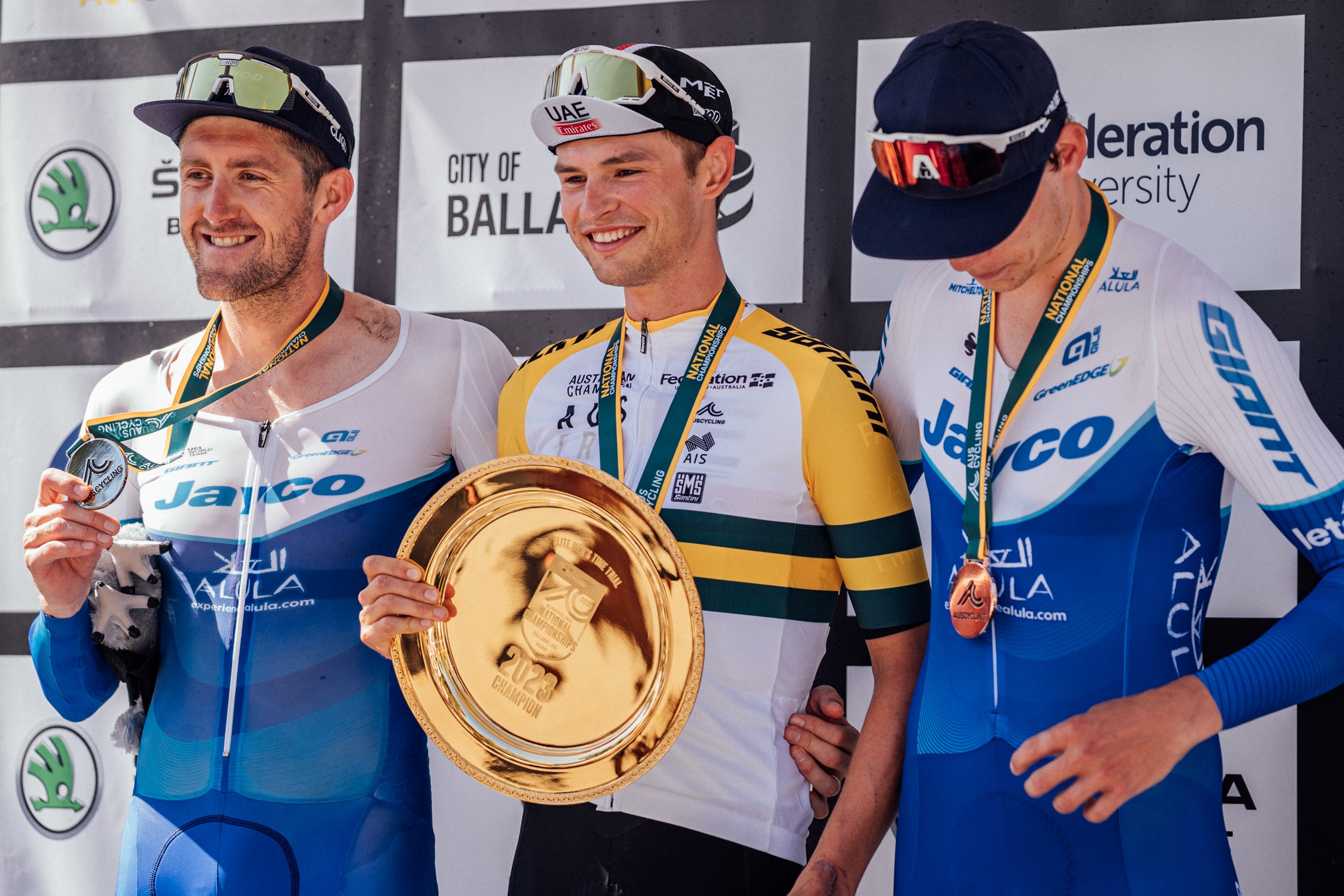 Australian road cyclists Jay Vine, Luke Durbridge and Kelland O'Brien on the podium of the 2023 individual time trial elite men's national championship in Buninyong, Ballarat, Victoria. Photo by Zac Williams.